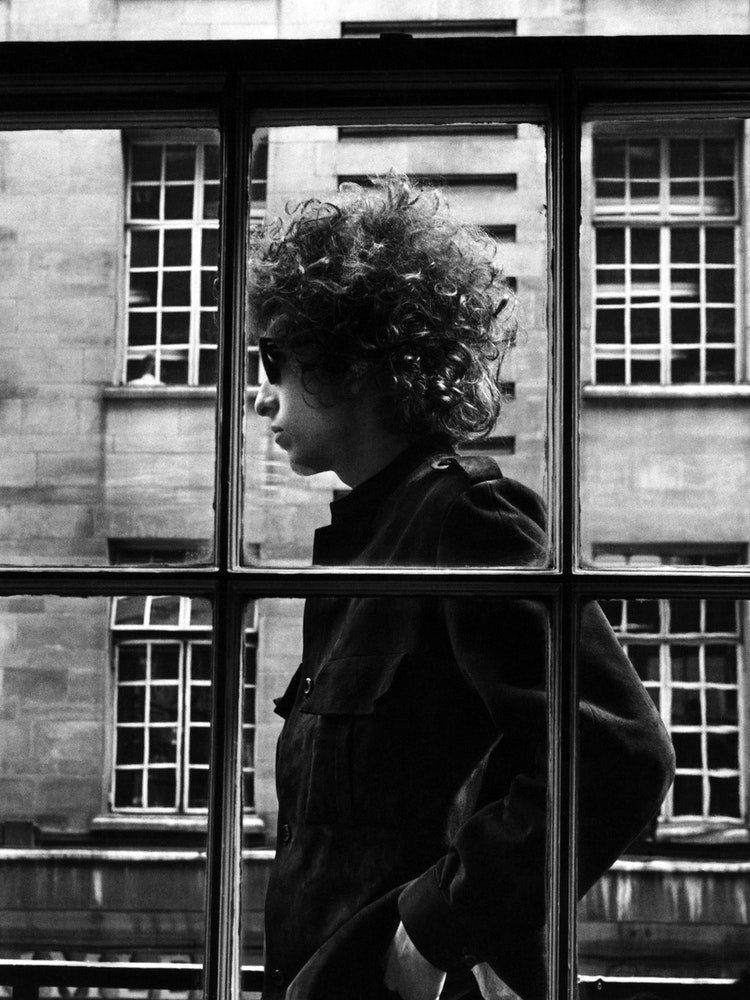 American Singer Bob Dylan Pictured Walking Past A Shop Window During His Visit To London Art Print